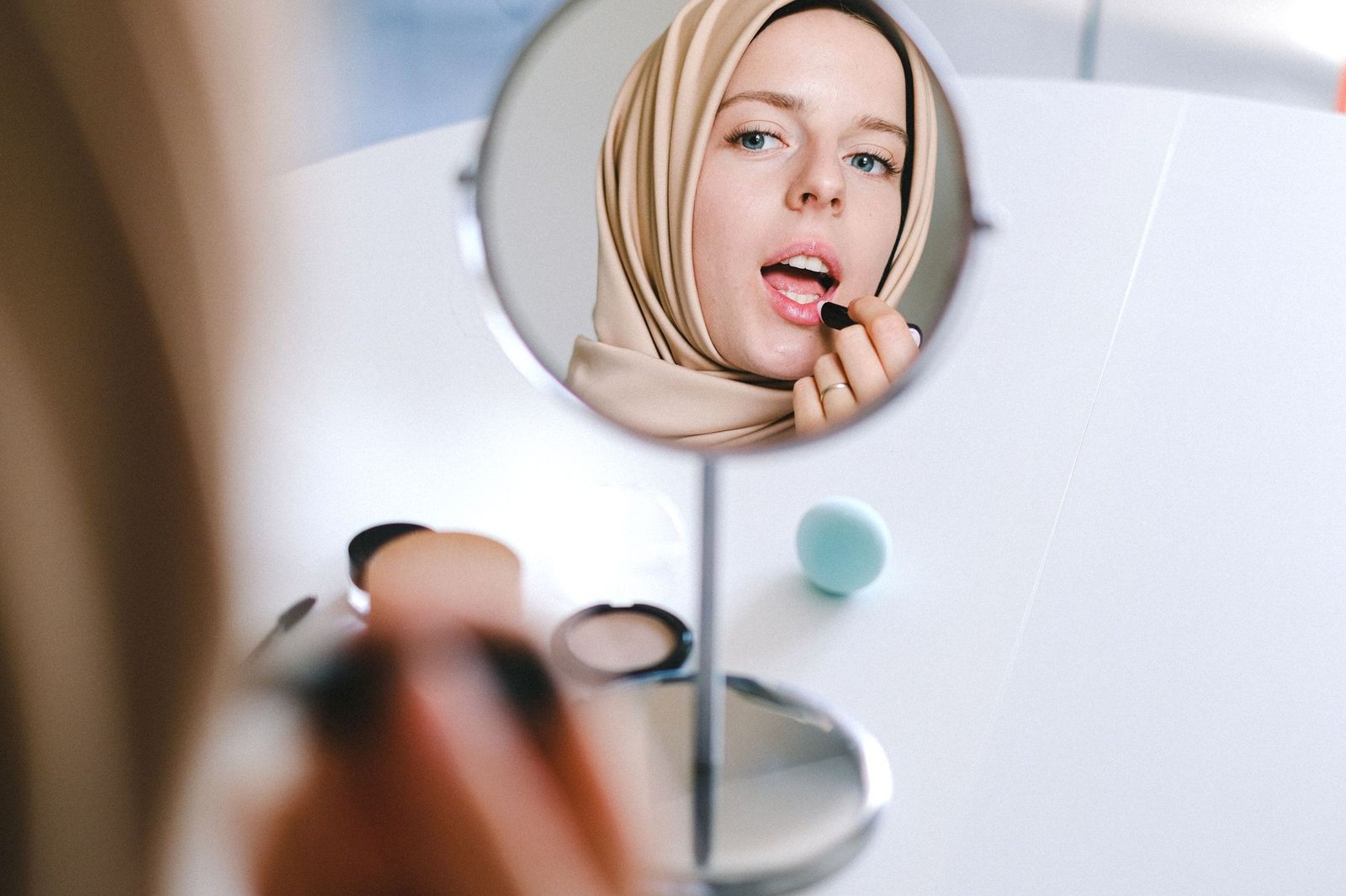 Applying lipstick
