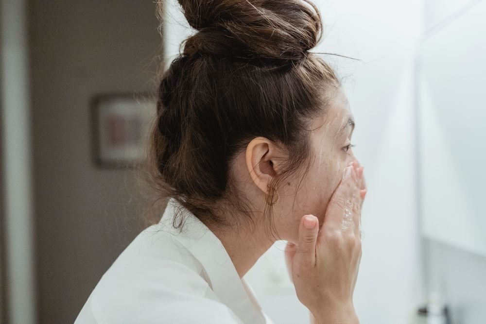 Woman washing face